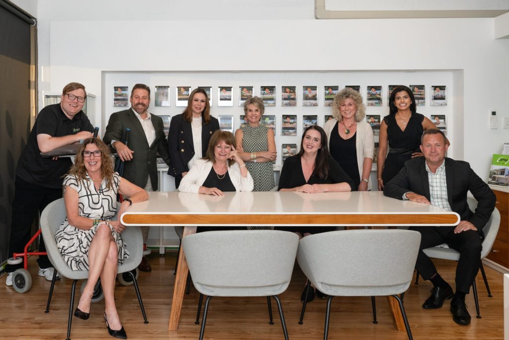 The Provincial Real Estate - Team sit at the office table, Kalamunda, Perth Hills facing the camera - From left to right - Hayden Marijanich, Dani Guy, Ben Ciocca, Liz Ciocca, Pamela Abraham, Samantha Lambert, Jasmine Fyfe, Joanne Pottinger, Allia Khanbhai, David Farrant.
